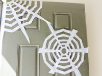 tape webs to door