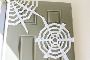 tape webs to door