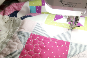 Quilting the Starry Night Quilt together.