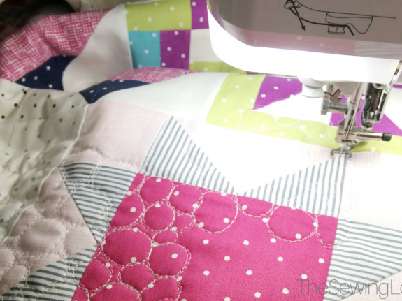 Quilting the Starry Night Quilt together.